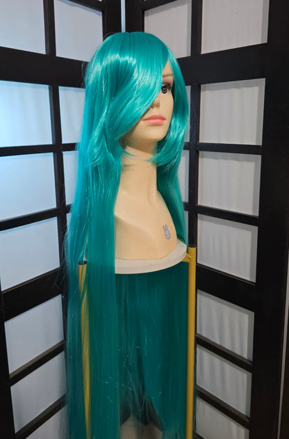 Peluca JOY Azul Turquesa Larga Lisa con Fleco L.10